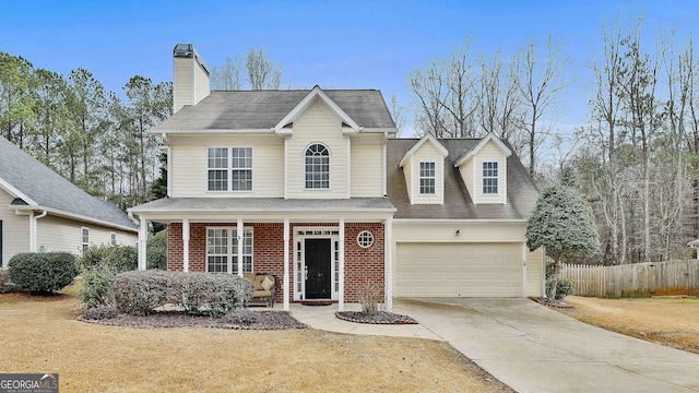 front of property featuring a garage and a porch