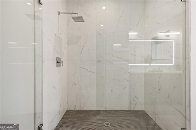 full bath featuring a marble finish shower