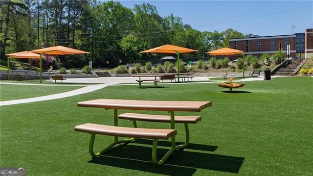 view of property's community featuring a yard