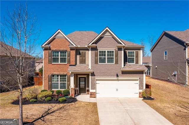 craftsman house featuring a garage, a shingled roof, concrete driveway, and brick siding