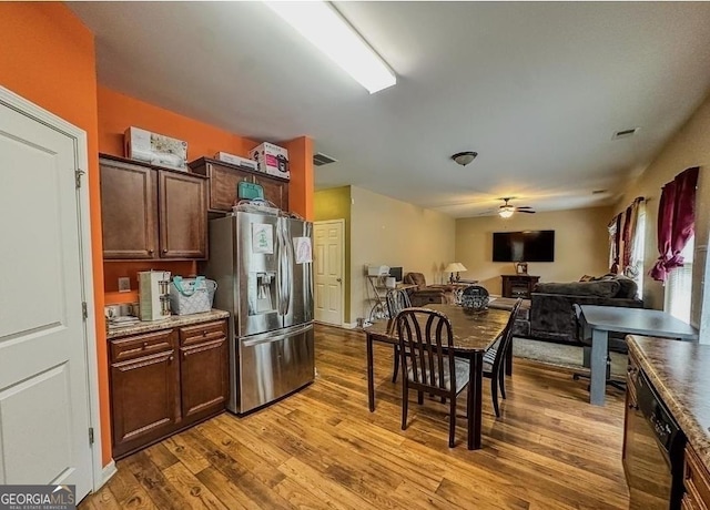 kitchen featuring dark brown cabinetry, stainless steel fridge with ice dispenser, dishwasher, ceiling fan, and light hardwood / wood-style floors