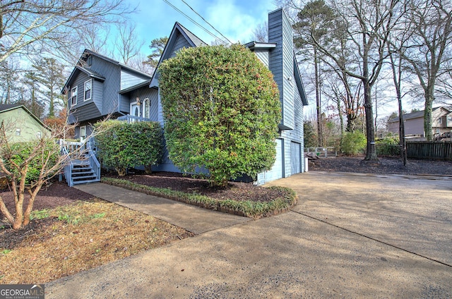 view of side of property featuring a garage