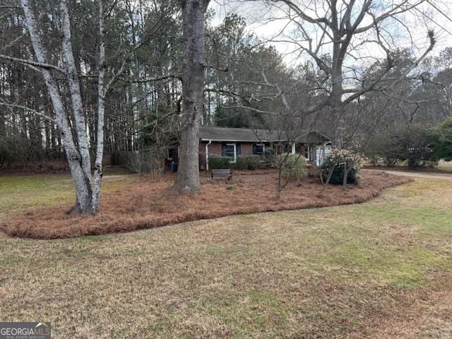 view of front of home with a front lawn