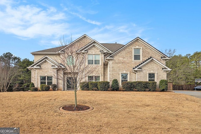 craftsman inspired home with a front yard