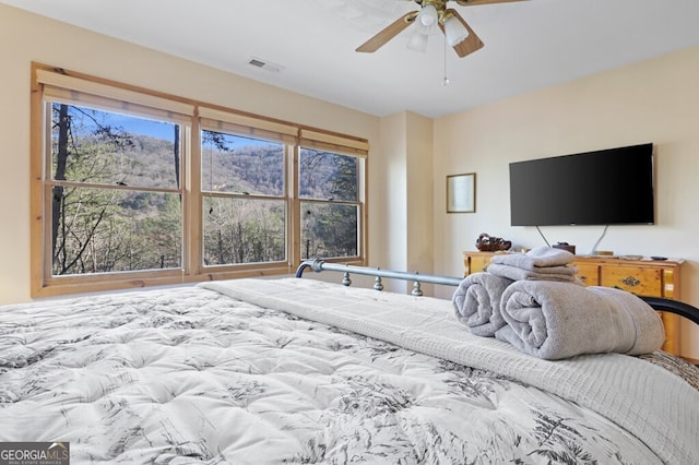 bedroom featuring ceiling fan and visible vents