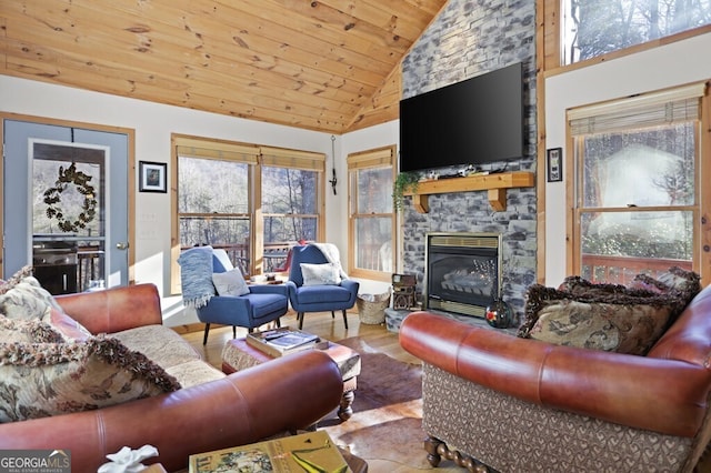 living area with wood ceiling, high vaulted ceiling, wood finished floors, and a stone fireplace