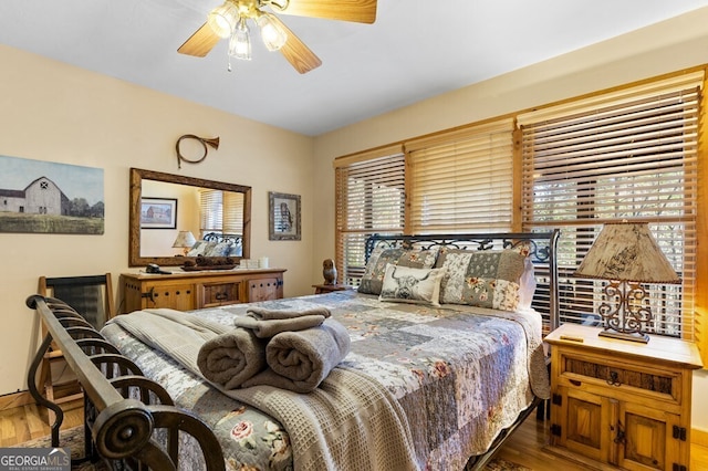 bedroom featuring ceiling fan and wood finished floors