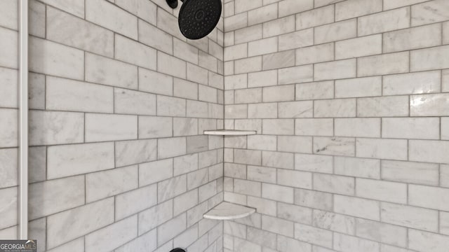 full bath featuring a tile shower