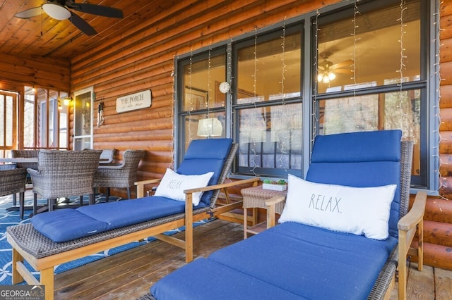 sunroom / solarium with wooden ceiling and a ceiling fan