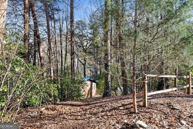 view of yard featuring a shed and an outbuilding