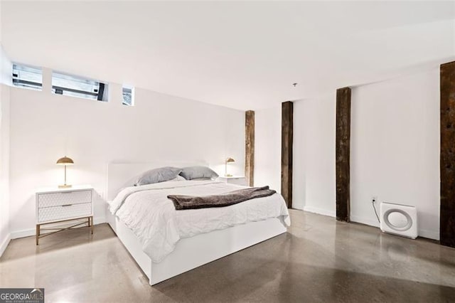 bedroom with concrete flooring