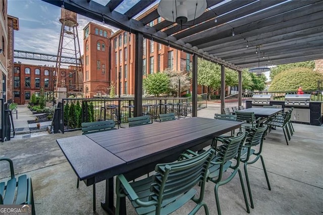 view of patio with a pergola and grilling area