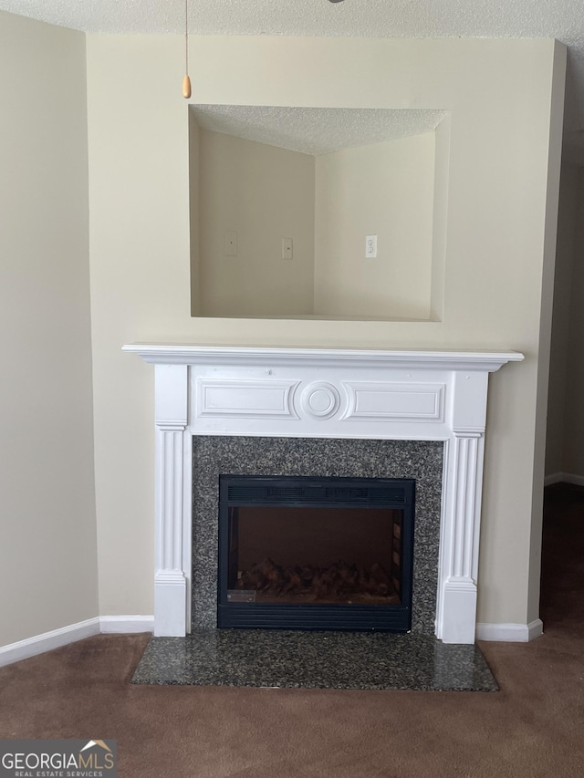 room details with carpet floors, a premium fireplace, and a textured ceiling