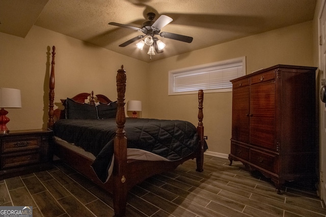 250 Little St Apt A105, Athens, GA 30605 - bedroom featuring wood tiled floors, ceiling fan, and baseboards