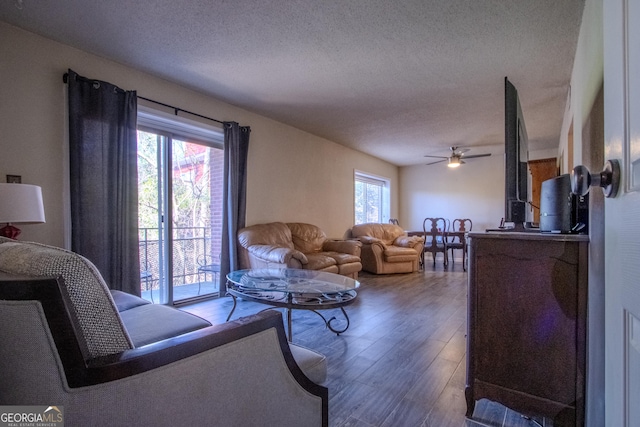 250 Little St Apt A105, Athens, GA 30605 - living room featuring wood finished floors, a textured ceiling, and a ceiling fan