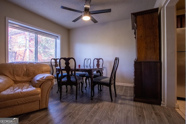 250 Little St Apt A105, Athens, GA 30605 - dining room featuring dark wood-type flooring, ceiling fan, baseboards, and a textured ceiling