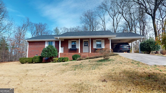 ranch-style house with a front lawn, a carport, and covered porch