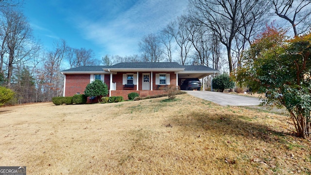 view of front of home with a carport, covered porch, and a front lawn