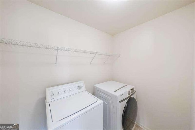 laundry area with washer and clothes dryer