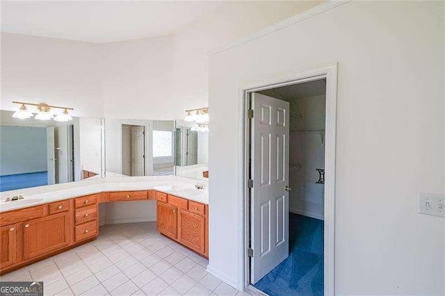 bathroom with vanity and tile patterned flooring