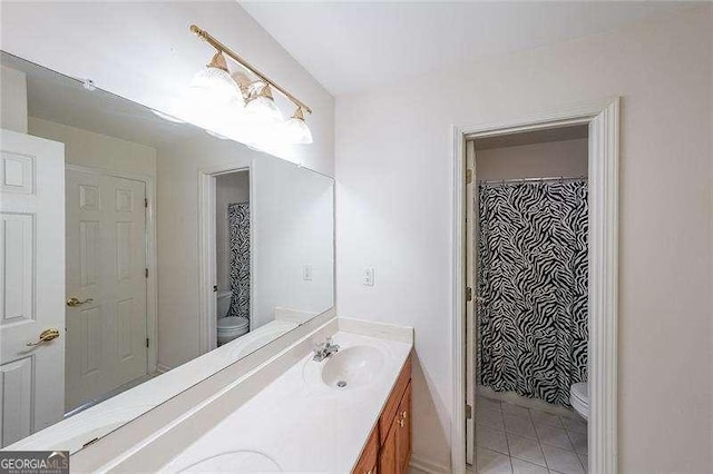 bathroom with vanity, tile patterned flooring, a shower with curtain, and toilet