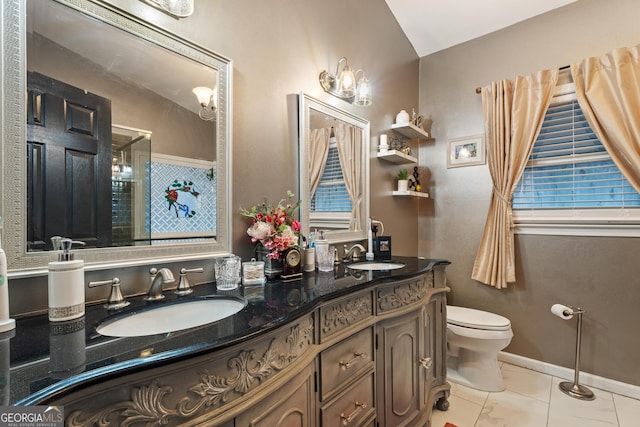 bathroom featuring vanity, toilet, a shower with shower door, and tile patterned flooring