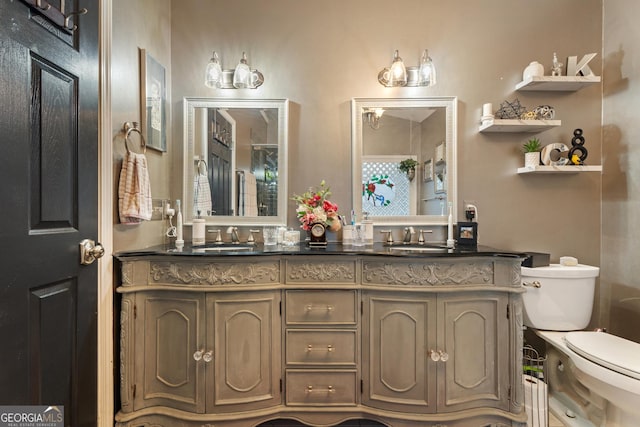 bathroom with vanity and toilet