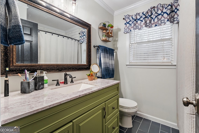 bathroom featuring crown molding, vanity, tile patterned floors, and toilet