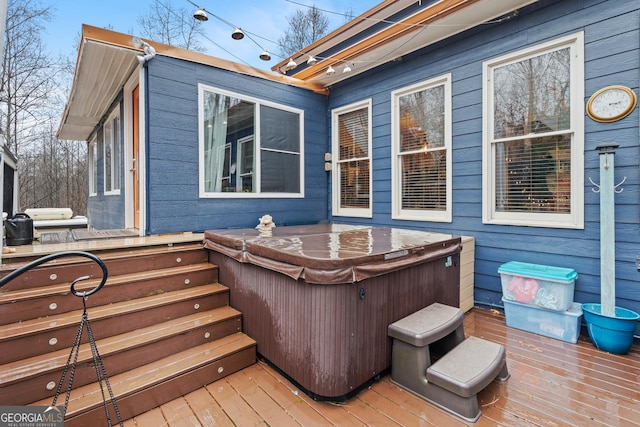 deck featuring a hot tub