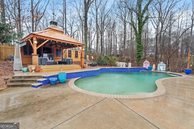 view of swimming pool featuring a gazebo and a patio