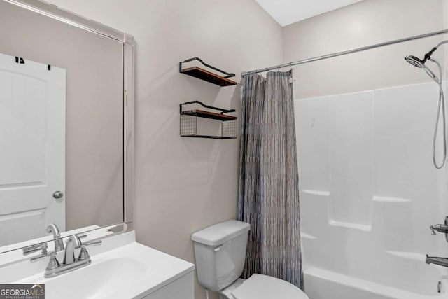 full bathroom featuring vanity, shower / tub combo, and toilet