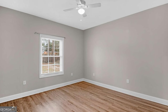 spare room with ceiling fan and light hardwood / wood-style flooring