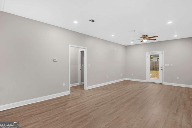 unfurnished living room with ceiling fan and light wood-type flooring