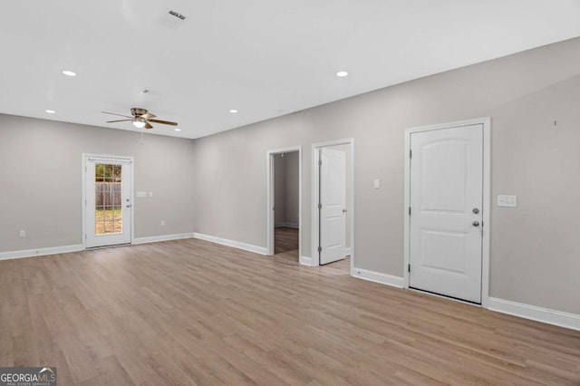 unfurnished living room featuring light hardwood / wood-style floors and ceiling fan