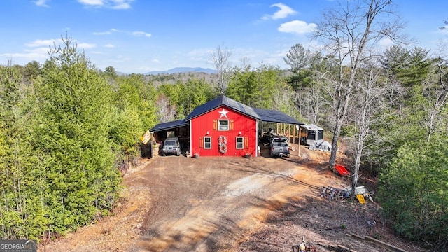 view of outbuilding with a carport