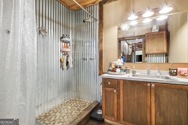 bathroom featuring vanity and a shower