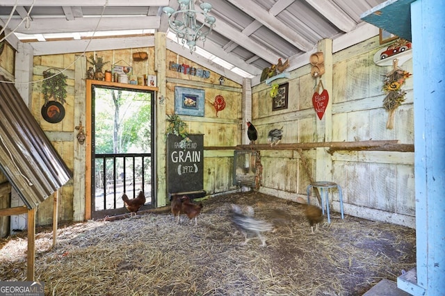 miscellaneous room featuring lofted ceiling