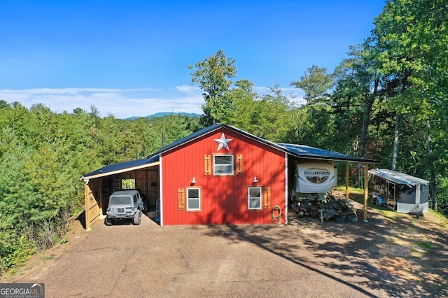 view of outdoor structure with a carport