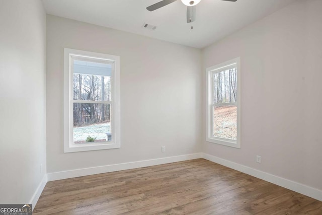 unfurnished room featuring ceiling fan and light wood-type flooring