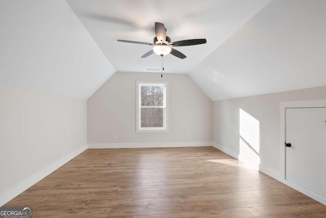 bonus room featuring ceiling fan, lofted ceiling, and light wood-type flooring