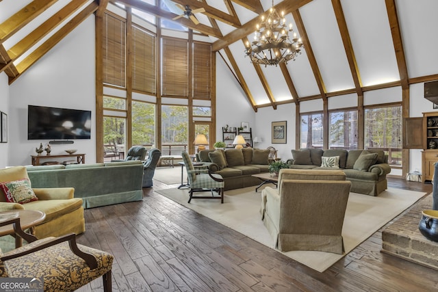 2724 Barnesville Hwy, Thomaston, GA 30286 - living area featuring high vaulted ceiling, beam ceiling, a ceiling fan, hardwood / wood-style floors, and a chandelier