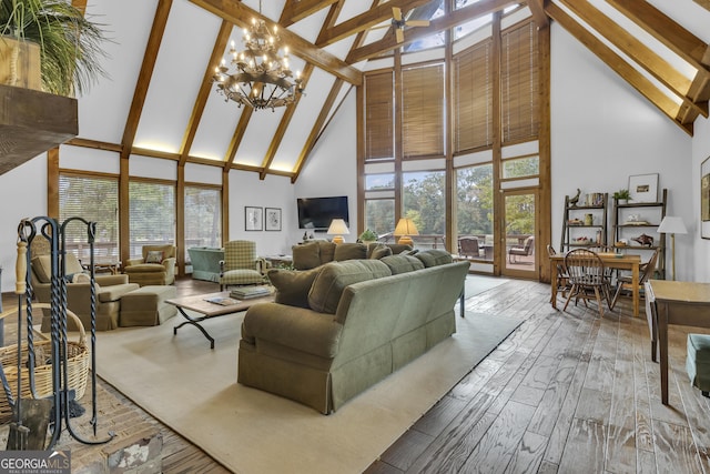 2724 Barnesville Hwy, Thomaston, GA 30286 - living area with high vaulted ceiling, beamed ceiling, wood finished floors, and a chandelier