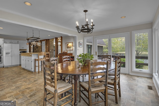 2724 Barnesville Hwy, Thomaston, GA 30286 - dining room with stone tile flooring, a chandelier, healthy amount of natural light, recessed lighting, and crown molding