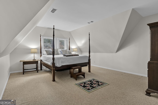 bedroom featuring light carpet, lofted ceiling, visible vents, and baseboards