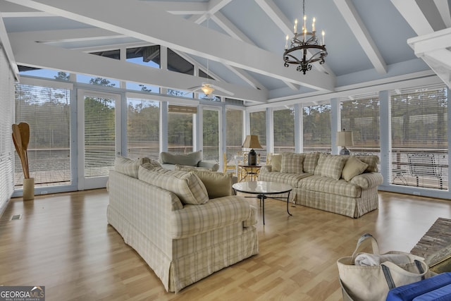 sunroom / solarium with lofted ceiling with beams, visible vents, and a notable chandelier