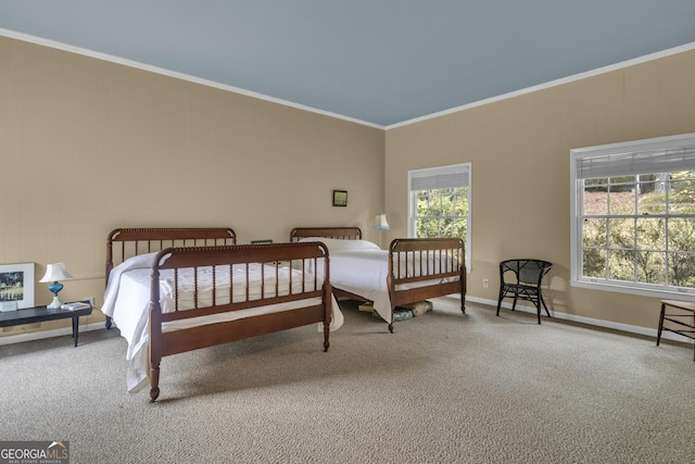 carpeted bedroom with baseboards, multiple windows, and ornamental molding