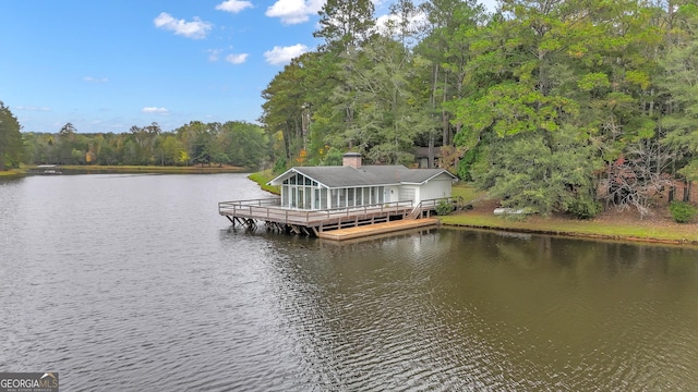 dock area with a water view and a wooded view