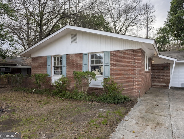 view of side of property featuring a garage