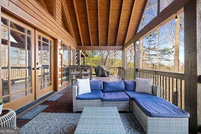 deck with an outdoor living space, a grill, and french doors