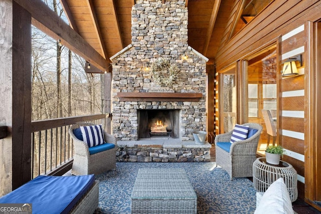 view of patio / terrace featuring an outdoor stone fireplace